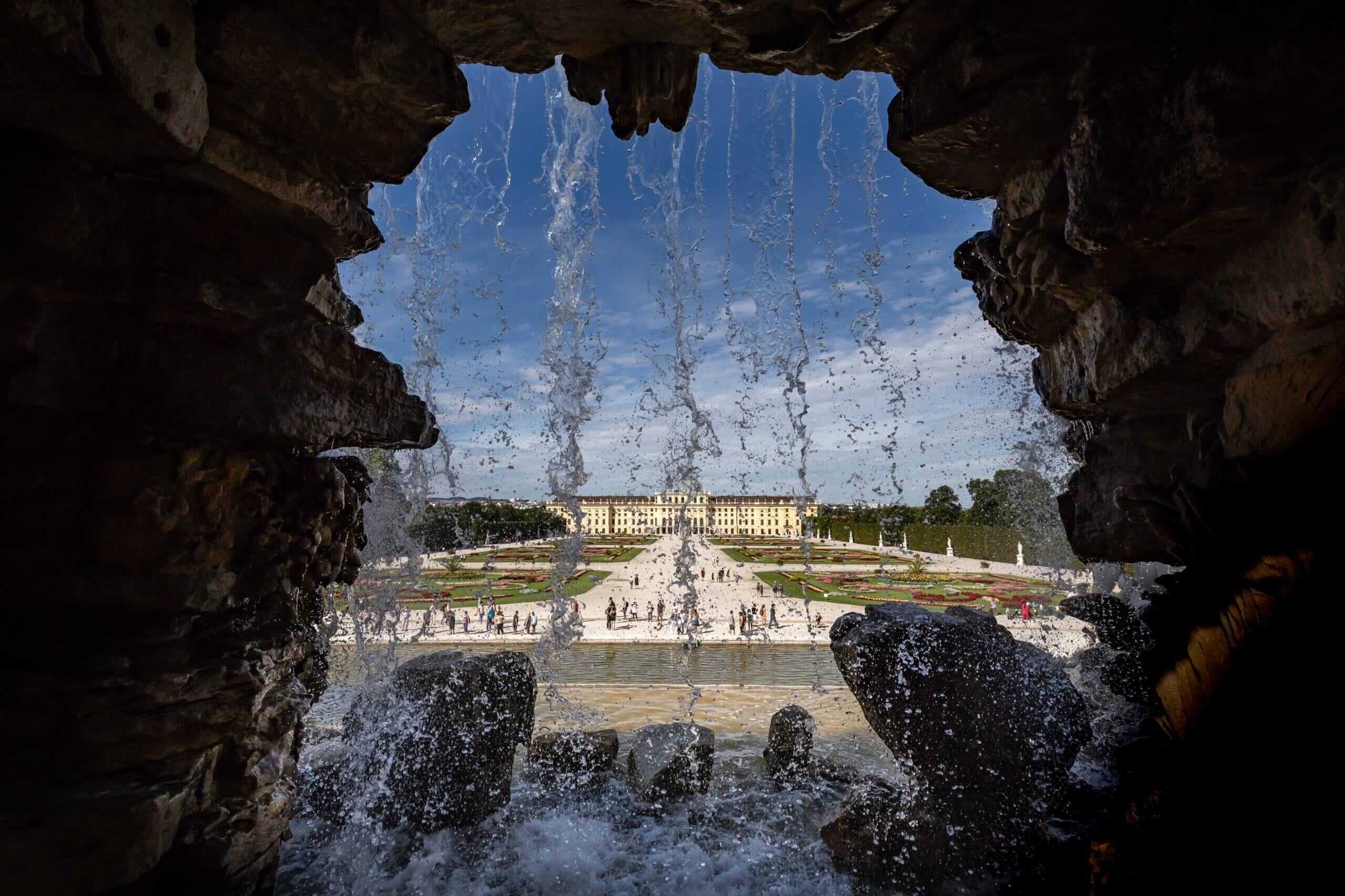 Beautiful shot of waterfalls with the view of schönbrunn palace in vienna, austria